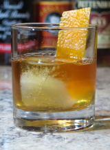 American Trilogy cocktail garnished with an orange twist