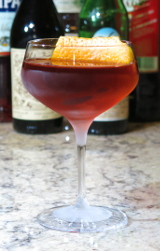 Autumn Negroni cocktail garnished with an orange twist