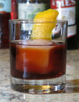 Chocolate Negroni cocktail garnished with an orange twist
