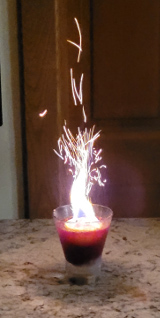 Fire of Olympus cocktail with a fire plume garnish