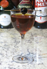 Fort Point cocktail garnished with a cocktail cherry