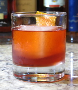 Jamaican Negroni cocktail garnished with an orange twist