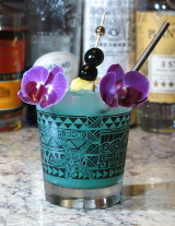 Marlin cocktail served over crushed ice with a pineapple and maraschino cherry garnish