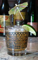 Montego Bay Cocktail with lime segment and umbrella flag garnish