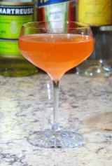 Naked and Famous Cocktail in a coupe glass