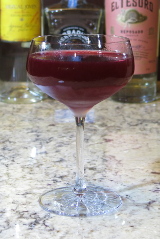 Serrano Hibiscus Rita Cocktail in a coupe glass