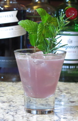 Windsor Garden cocktail with mint and rosemary garnish
